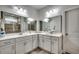 Bathroom features double sink vanity with white cabinets and stone countertops at 1286 Culbertson Ave., Myrtle Beach, SC 29577