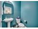 Charming powder room with blue walls, pedestal sink, and modern fixtures at 1286 Culbertson Ave., Myrtle Beach, SC 29577