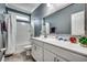 Well-maintained bathroom with white vanity, decorative mirror, and shower-tub combo at 1286 Culbertson Ave., Myrtle Beach, SC 29577