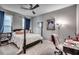 Cozy bedroom with a four-poster bed, ceiling fan, and decor at 1286 Culbertson Ave., Myrtle Beach, SC 29577