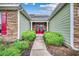 Welcoming entryway with red double doors, stone accents, and manicured landscaping at 1286 Culbertson Ave., Myrtle Beach, SC 29577