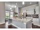 Bright kitchen with white cabinets, granite counters, and stainless steel appliances at 1286 Culbertson Ave., Myrtle Beach, SC 29577