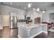 Open kitchen features stainless steel appliances and a large granite island at 1286 Culbertson Ave., Myrtle Beach, SC 29577