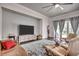 Bright living room with a ceiling fan, plush furniture, television, and access to the outdoor patio at 1286 Culbertson Ave., Myrtle Beach, SC 29577