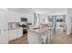 Bright kitchen area with stainless appliances, granite countertops, an island, and an open dining room at 132 Hoffman Park Dr. # 13, Myrtle Beach, SC 29588