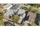 Aerial view shows home with a large driveway and inviting pool and outdoor recreation area at 1415 Edge Dr., North Myrtle Beach, SC 29582