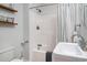 A full bathroom featuring a single sink, tub shower combination, and floating shelves at 1415 Edge Dr., North Myrtle Beach, SC 29582