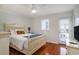 A light and bright bedroom with wood floors, door to exterior, and large closet space at 1415 Edge Dr., North Myrtle Beach, SC 29582