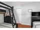 A bedroom with two twin beds, dark wood furniture and floors, and a TV at 1415 Edge Dr., North Myrtle Beach, SC 29582