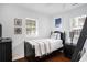 A bedroom with dark furniture, wood floors, and windows with natural light at 1415 Edge Dr., North Myrtle Beach, SC 29582
