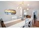 Dining area with contemporary lighting fixture and a view into the living room at 1415 Edge Dr., North Myrtle Beach, SC 29582