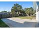 Large driveway and backyard with mature palms at 1415 Edge Dr., North Myrtle Beach, SC 29582