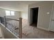 Upstairs loft space featuring wood floors and a window with natural light at 1430 Crested Iris Way, North Myrtle Beach, SC 29582
