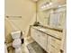 Bathroom with granite countertops, white cabinetry, and neutral wall paint at 144 Puffin Dr. # 1-A, Pawleys Island, SC 29585