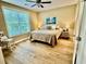 Cozy bedroom with neutral decor, hardwood floors, and a large window at 144 Puffin Dr. # 1-A, Pawleys Island, SC 29585