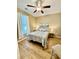 Charming bedroom with hardwood floors, a large window, and neutral décor at 144 Puffin Dr. # 1-A, Pawleys Island, SC 29585