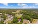 Aerial view showcasing the neighborhood and its tranquil, tree-lined streets and beautiful landscape at 1720 Horry St., Conway, SC 29526