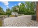 Spacious backyard featuring a basketball court, storage shed, and stone fire pit at 1720 Horry St., Conway, SC 29526