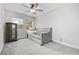 Bright bedroom features a ceiling fan, large window with view, and a futon for relaxing at 1720 Horry St., Conway, SC 29526