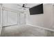 Cozy bedroom with a ceiling fan, carpet floors, and mounted TV at 1720 Horry St., Conway, SC 29526