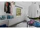 Walk-in closet featuring ample hanging and shelving space with a window at 1720 Horry St., Conway, SC 29526