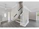 Bright foyer with stylish gray flooring, a staircase, and an open entryway at 1720 Horry St., Conway, SC 29526