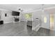 Cozy living room featuring a fireplace, gray flooring, and a ceiling fan at 1720 Horry St., Conway, SC 29526