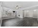 Open-concept living room with modern gray floors leading to the dining area and kitchen at 1720 Horry St., Conway, SC 29526