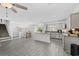 Spacious open-concept featuring kitchen, dining, and living areas with gray flooring at 1720 Horry St., Conway, SC 29526