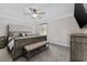Spacious main bedroom with a ceiling fan, upholstered bed, and carpeted floors at 1720 Horry St., Conway, SC 29526
