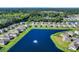 Aerial view of a community with pond and water feature surrounded by lush landscaping and homes at 1748 Promise Pl., Myrtle Beach, SC 29588