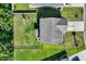 Aerial view showcases the layout of home with outdoor living, a playset, and green backyard at 1748 Promise Pl., Myrtle Beach, SC 29588
