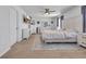Bright bedroom with a white bed set, gray curtains, TV, dresser and soft carpet at 1748 Promise Pl., Myrtle Beach, SC 29588