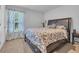 Bedroom with neutral colored walls, plush carpet and decorative window treatments at 1748 Promise Pl., Myrtle Beach, SC 29588