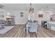 Open-concept dining area with modern lighting fixture and neutral color palette at 1748 Promise Pl., Myrtle Beach, SC 29588