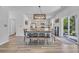 Dining room with modern lighting, seating, and a view into the kitchen at 1748 Promise Pl., Myrtle Beach, SC 29588