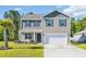 Charming two-story home with a well-manicured lawn and a two-car garage at 1748 Promise Pl., Myrtle Beach, SC 29588