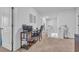 Upstairs hallway featuring a dark wood desk, chair, and bookshelf with neutral carpet floors at 1748 Promise Pl., Myrtle Beach, SC 29588