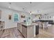A kitchen island and breakfast bar adjoin the open-concept kitchen and dining room at 1748 Promise Pl., Myrtle Beach, SC 29588
