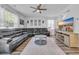 Living room with a ceiling fan and black leather furniture and a gray rug at 1748 Promise Pl., Myrtle Beach, SC 29588