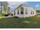 Spacious backyard with lush lawn and a home exterior with bay windows, a patio and outdoor furniture at 1755 Fairbanks Dr., Conway, SC 29526
