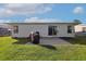 Well-maintained backyard featuring a concrete patio area and pristine, green lawn at 1755 Fairbanks Dr., Conway, SC 29526