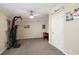 A carpeted bedroom with a ceiling fan and neutral colors, suitable for exercise equipment and home office setup at 1755 Fairbanks Dr., Conway, SC 29526