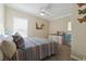 Cozy bedroom with natural light, ceiling fan, and dresser at 1755 Fairbanks Dr., Conway, SC 29526