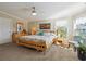 Bedroom with carpet, wooden furniture, ceiling fan, bay window, mermaid wall art and natural light at 1755 Fairbanks Dr., Conway, SC 29526