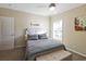 Comfortable bedroom with a brightly patterned quilt and natural light from a nearby window at 1755 Fairbanks Dr., Conway, SC 29526