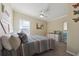 Charming bedroom featuring a queen-sized bed, soft carpet, and a stylish dresser with a mirror at 1755 Fairbanks Dr., Conway, SC 29526