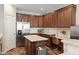 Kitchen with wooden cabinets, granite countertops, stainless steel appliances, and island with seating at 1755 Fairbanks Dr., Conway, SC 29526