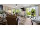 Cozy living room with a ceiling fan, large windows, and sliding glass door with outside view at 1755 Fairbanks Dr., Conway, SC 29526