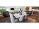 Open-concept living area features a dining table and chairs, view to kitchen, and access to outside at 1755 Fairbanks Dr., Conway, SC 29526